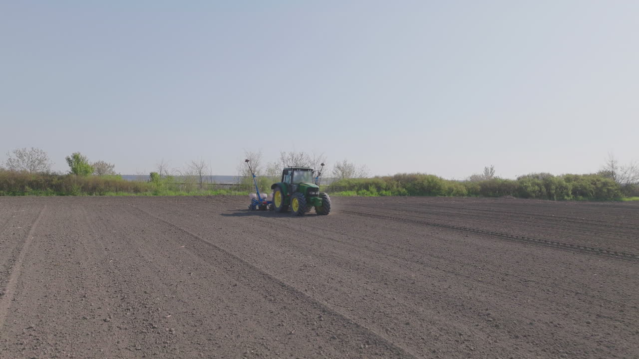Tractor Planting Seeds in Field