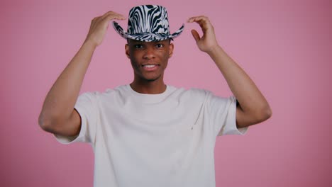 man wearing zebra print cowboy hat