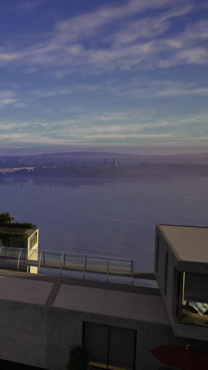 Vista dello skyline della città e del fiume al crepuscolo da un balcone