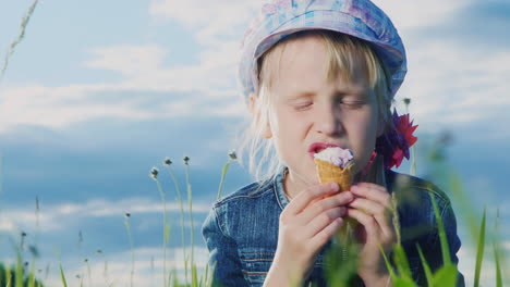 8 year old girl eating  ice cream in green meadow 04