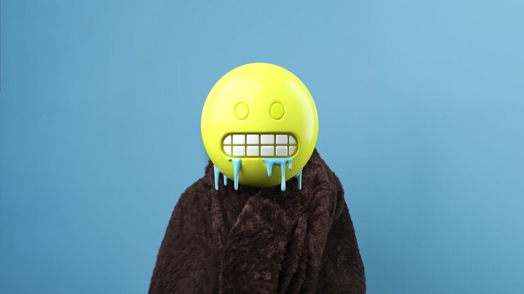 Emoji frozen head cold shiver with a blanket. Emoji concept