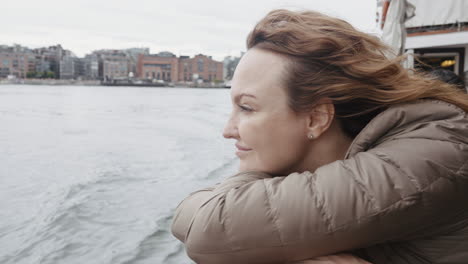 woman enjoying a view from a boat