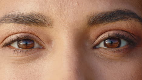 close-up-macro-eyes-of-beautiful-hispanic-woman-winking-playfully-healthy-eyesight-concept