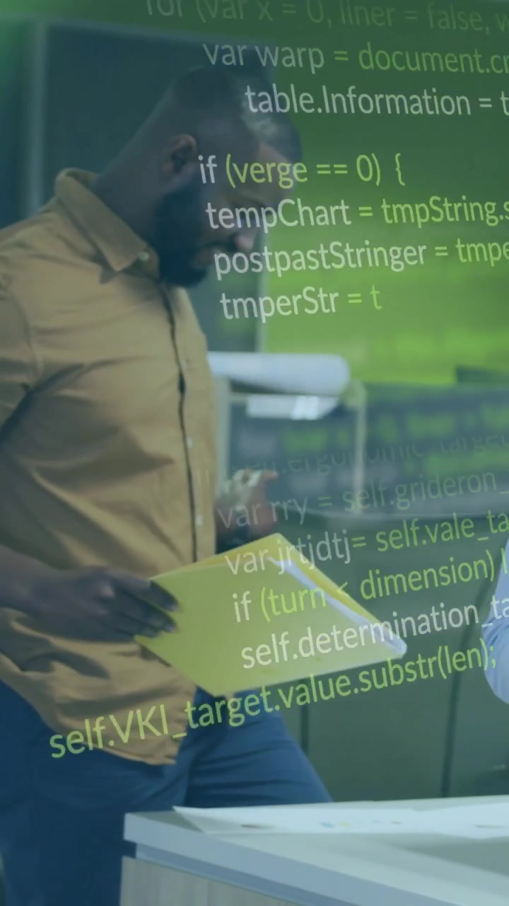 Vertical video: Pan code rising over yellow folder as man flipping pages in tech office for review