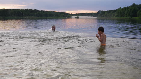 Father-and-son-swimming-on-the-beach