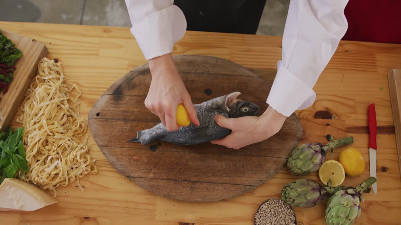 Chef cleaning a fish