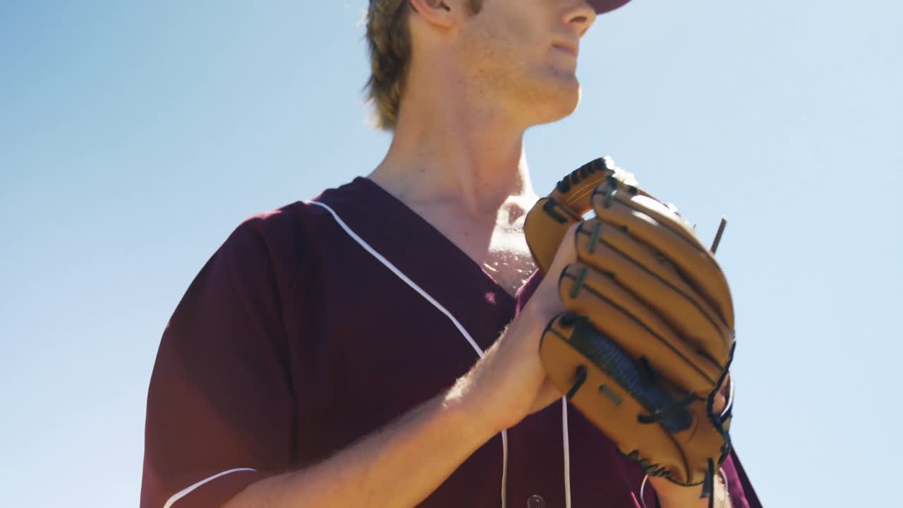 Baseball players holding ball during practice session