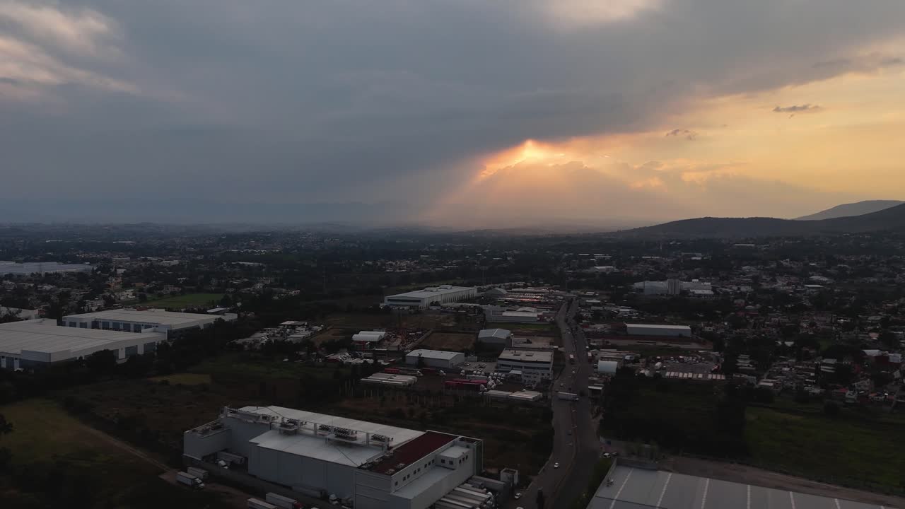 Dramatic Sunset Over Industrial Cityscape in Mexico
