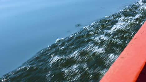 progression of a boat's bow moving over water