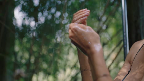 sexy woman in shower wearing bikini washing body cleansing skin with refreshing water enjoying natural beauty spa showering outdoors in nature