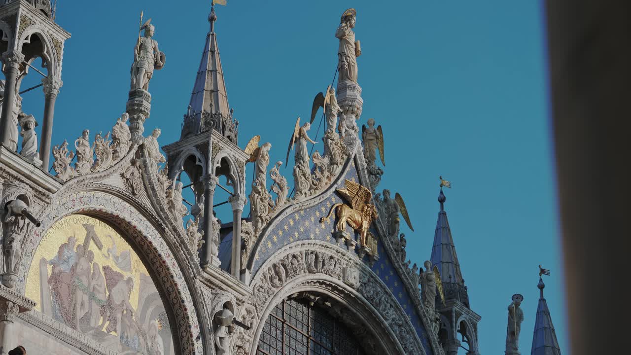 Iconic front facade of St Mark's Basilica with historical mosaics, Venice