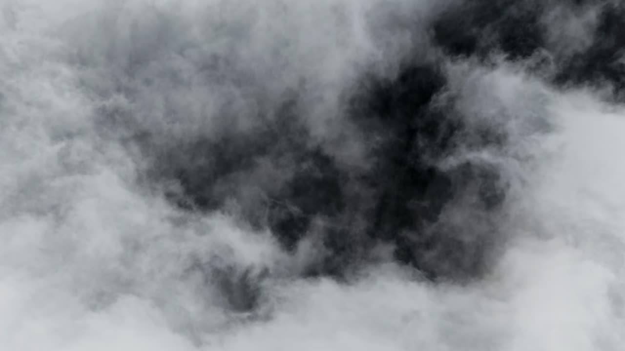 Dark swirling clouds in a stormy sky evoke mystery and drama