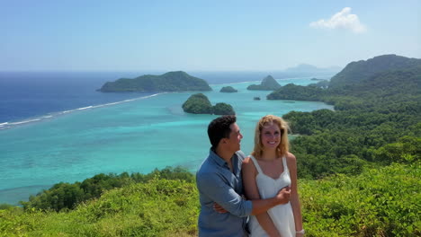 romantic couple overlooking a tropical island paradise