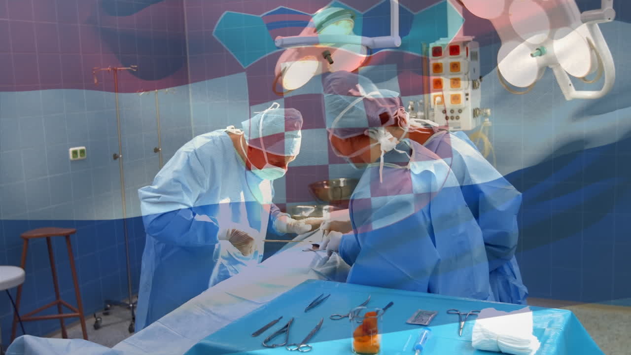 크로아티아 국기가 수술실에 있는 외과 의사들 위에서 흔들리는 애니메이션