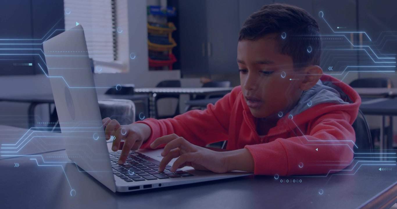 Vertical video: Reacting to circuit effect boy in red hoodie leaning and typing on laptop in school