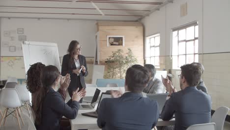 Colleagues-applauding-after-presentation