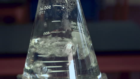 surface of rapidly boiling water in an erlenmeyer flask