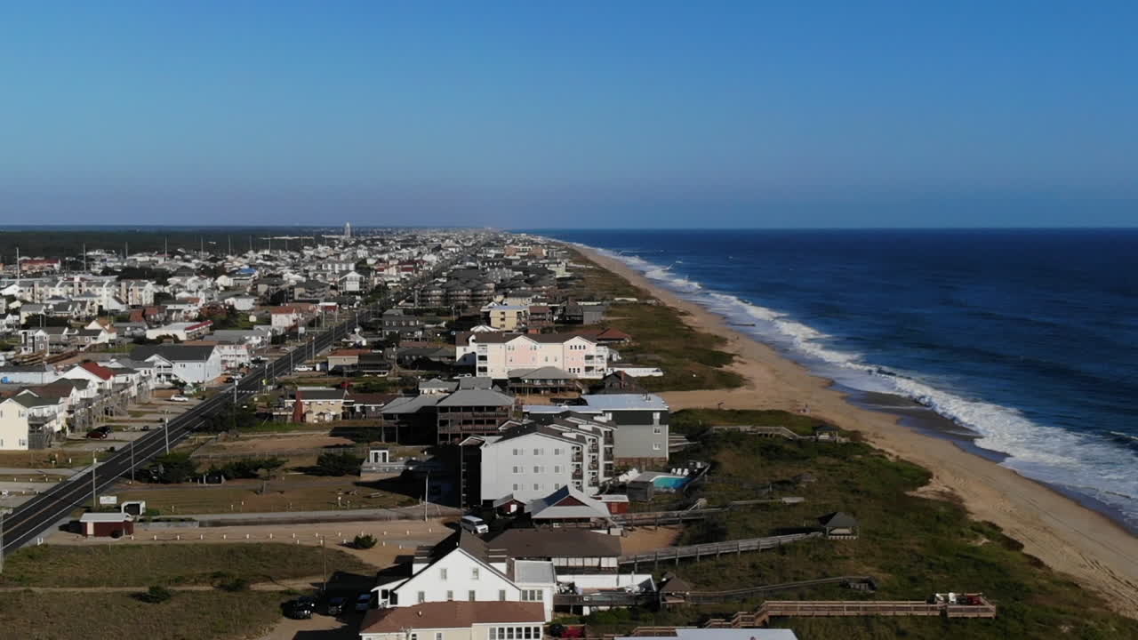 Aerial View of Coastal Town with Beach and Ocean