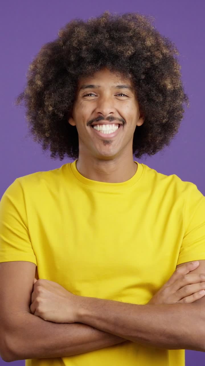 Happy Man with Afro and Mustache Smiling in Yellow T-shirt