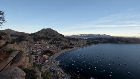 experience a breathtaking sunset over copacabana, bolivia, in this captivating time-lapse from a high vantage point. beauty of the town and lake titicaca as the sky transforms with vibrant golden hour