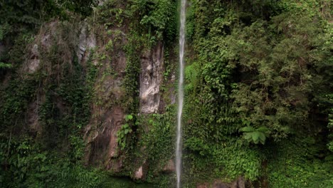 drone shot of katibawasan falls, tourist attraction on camiguin island, philippines