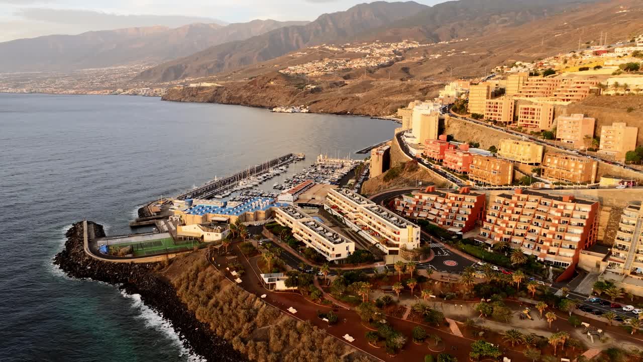 Golden light reveals vibrant coastal Radazul and sea port in early Spanish dawn