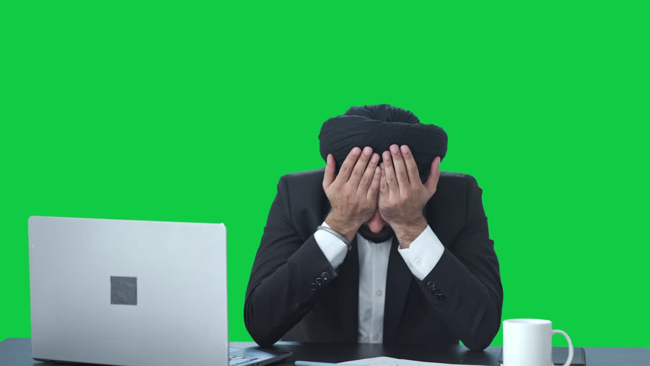 Tensed and stressed Sikh Indian businessman Green screen