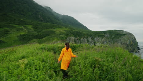 woman hiking in mountains by the ocean