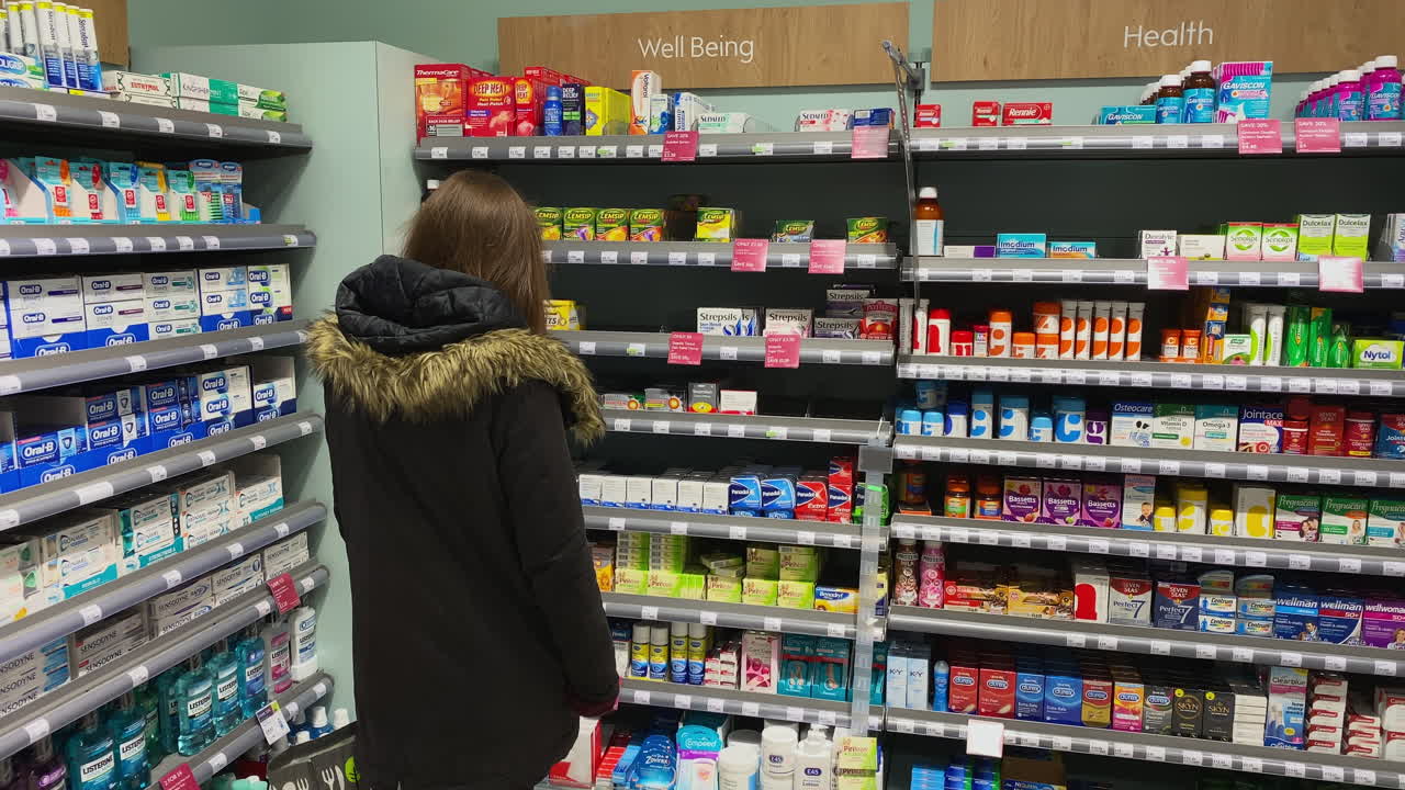 A woman in the health and well being section of a supermarket in Oundle Northamptonshire.