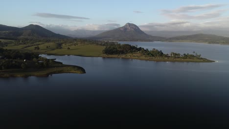 Morning-light-over-a-lake-and-mountain-in-a-background