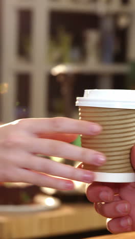 waitress serving a coffee to customer