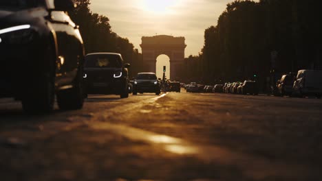 sunset traffic jam at arc de triomphe, paris