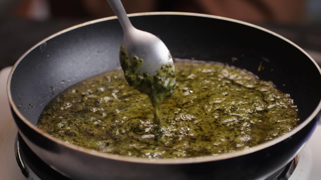 Cooking Green Herb Sauce in a Pan