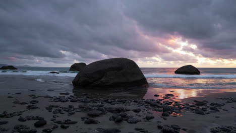 dramatic sunset over a rocky beach
