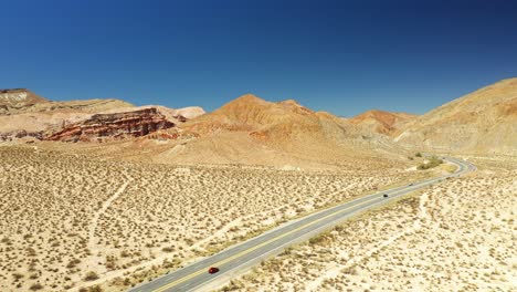 Midland-trail's-Highway-14-and-the-Mojave-Desert-traffic-and-landscape---dynamic-aerial-hyper-lapse