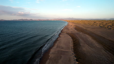 Drone-shot-of-the-descent-of-the-mogote-dunes-in-south-california-south-mexico