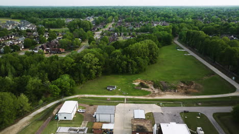 Collierville-wastewater-treatment-plant-surrounded-by-green-areas-and-residential-neighborhood,-tennessee,-aerial-view