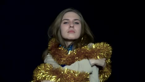 woman playing with christmas tinsel