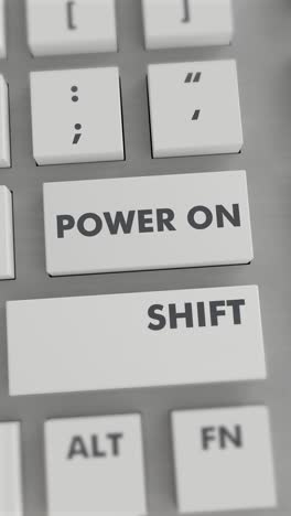pulsando el botón de encendido en el teclado vídeo vertical