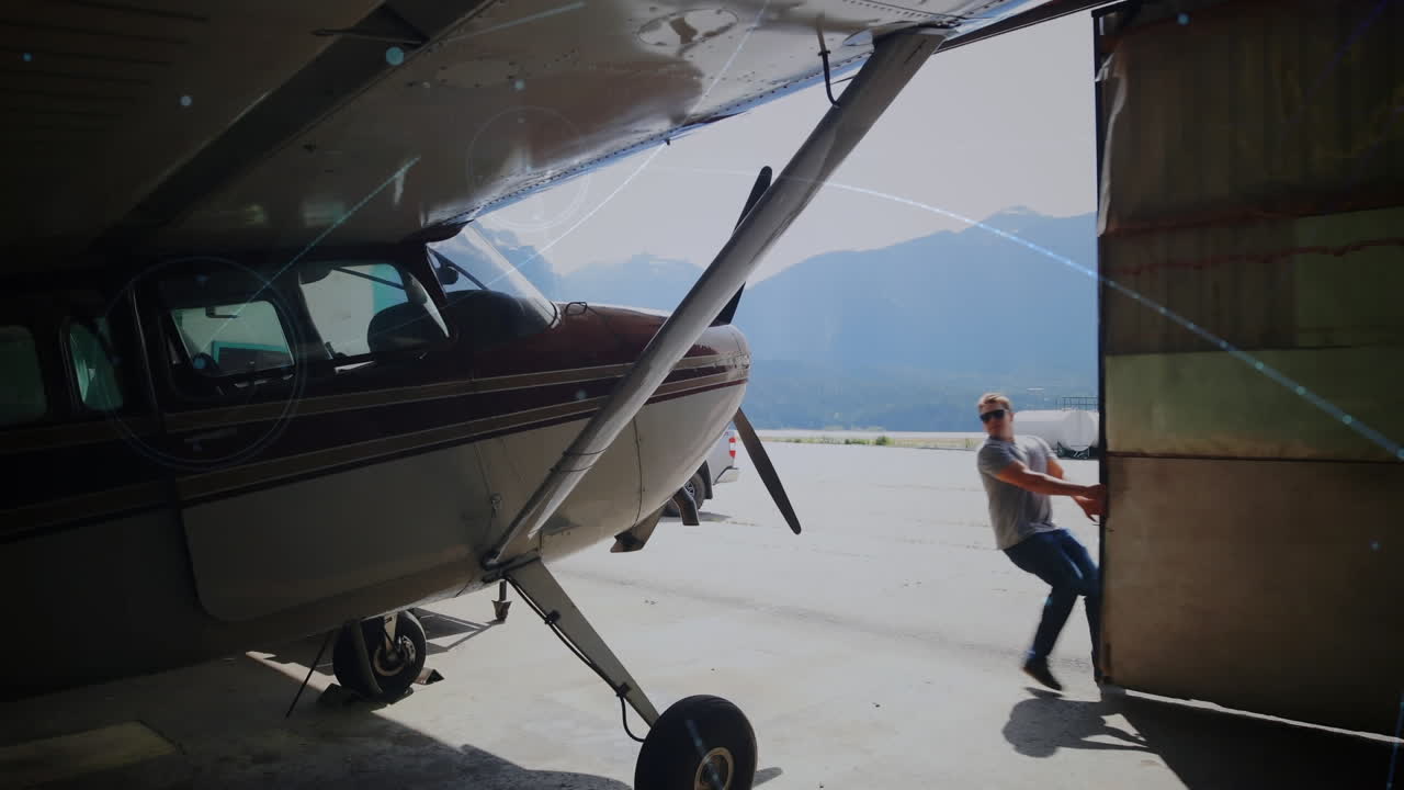 Animazione di un globo con rete di connessioni su un aereo in hangar