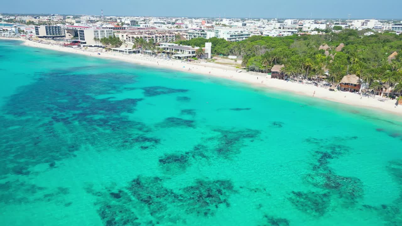 Playa del carmen beach with turquoise water and nearby resorts, aerial view