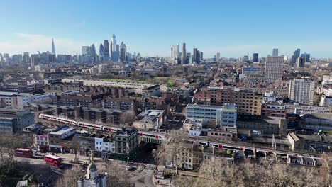 train on overground railway line bethnal green east london uk drone,aerial