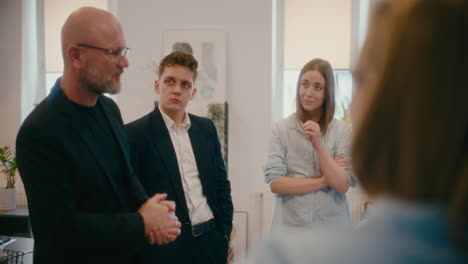 businessman explaining employees in meeting.