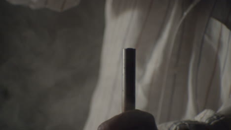 hammer hitting a big nail in a dramatic misty ambience