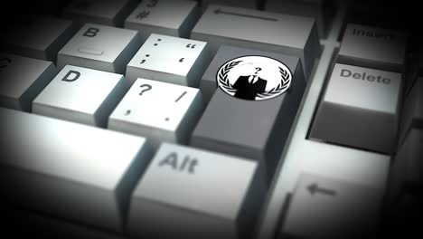 botón de logotipo anónimo en el teclado de la computadora
