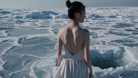 woman in a dress on a frozen lake