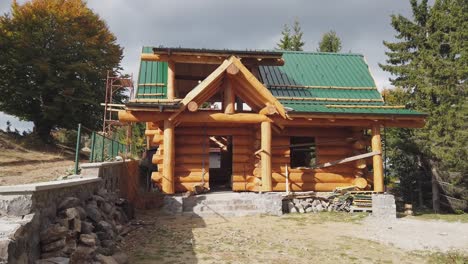 constructed from a wooden log house, wooden mountain house construction site