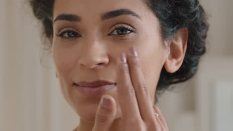 portrait beautiful young woman looking in mirror at perfect healthy skin touching face with hands enjoying smooth natural complexion with anti aging skincare getting ready at home beauty concept