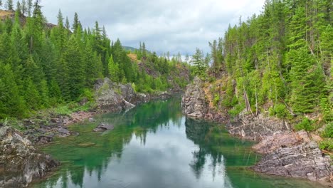 reflections on the turquoise water of flathead river in montana, united states