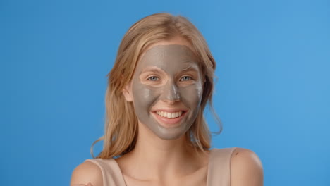 woman with a clay face mask
